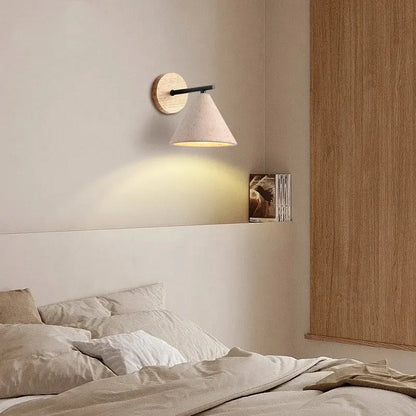 Minimalist wall lights with circular wooden backplate, black metal arm, and beige shade for yellow travertine decorbites iron yellow