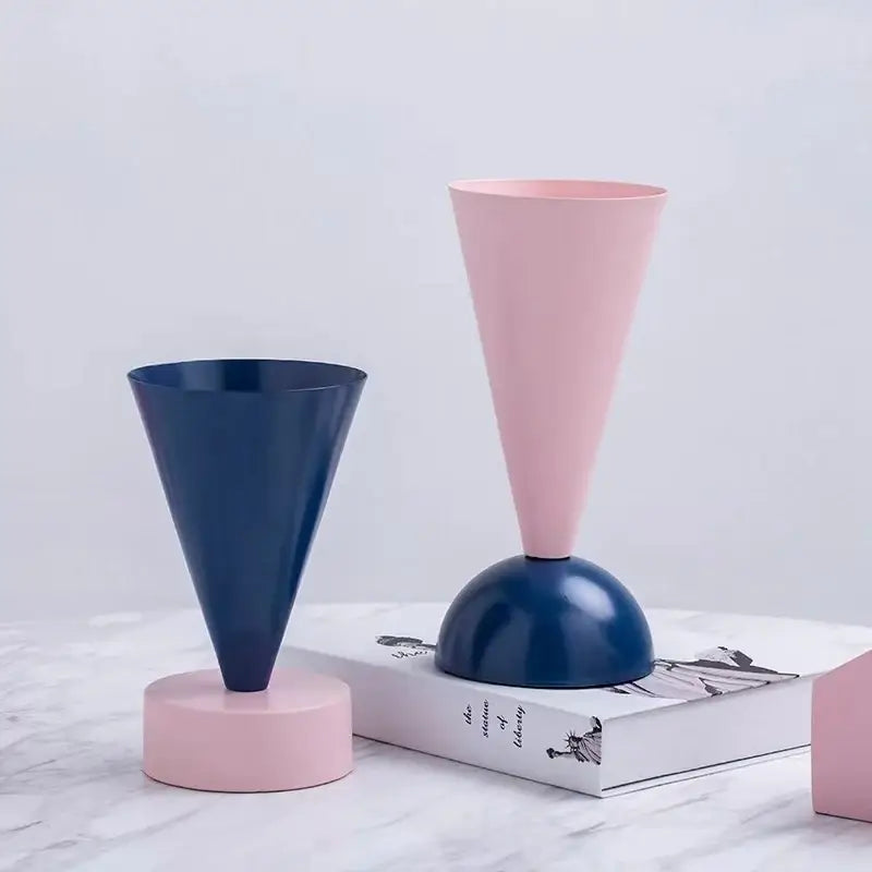 A sleek modern cone-shaped navy blue geometric triangle vase for decorbites geometric triangle living room decor