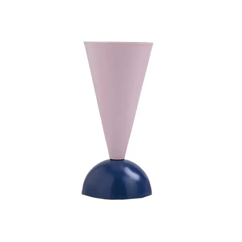 A minimalist pink and navy blue geometric triangle vase with a soft conical body and glossy hemispherical base for decorbites decor