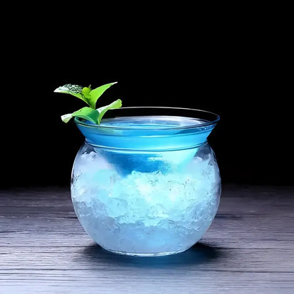 Translucent blue glass 150ml stemless martini chiller filled with ice and garnished with fresh mint for dining room entertaining