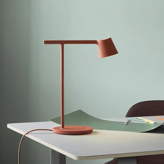 Terracotta minimalist dimmable desk light with sleek matte finish designed as a modern table lamp for bedroom use