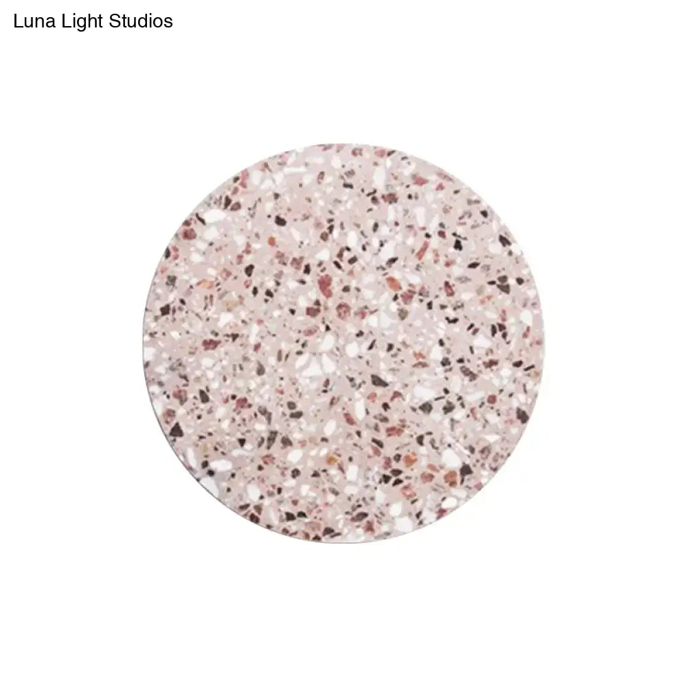 Minimalist terrazzo round led wall sconce in pink white and dark speckled pattern for bedroom lighting