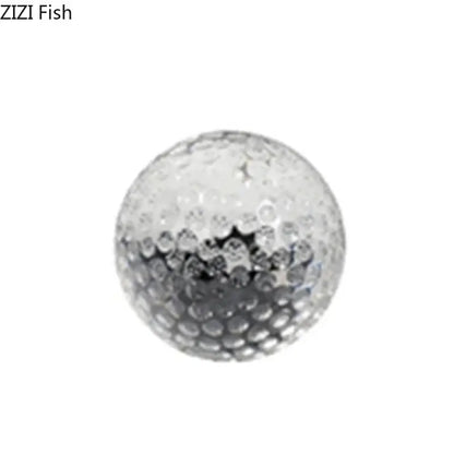 Silver minimalist textured glass crystal ball desk decoration with dimpled surface and reflective finish