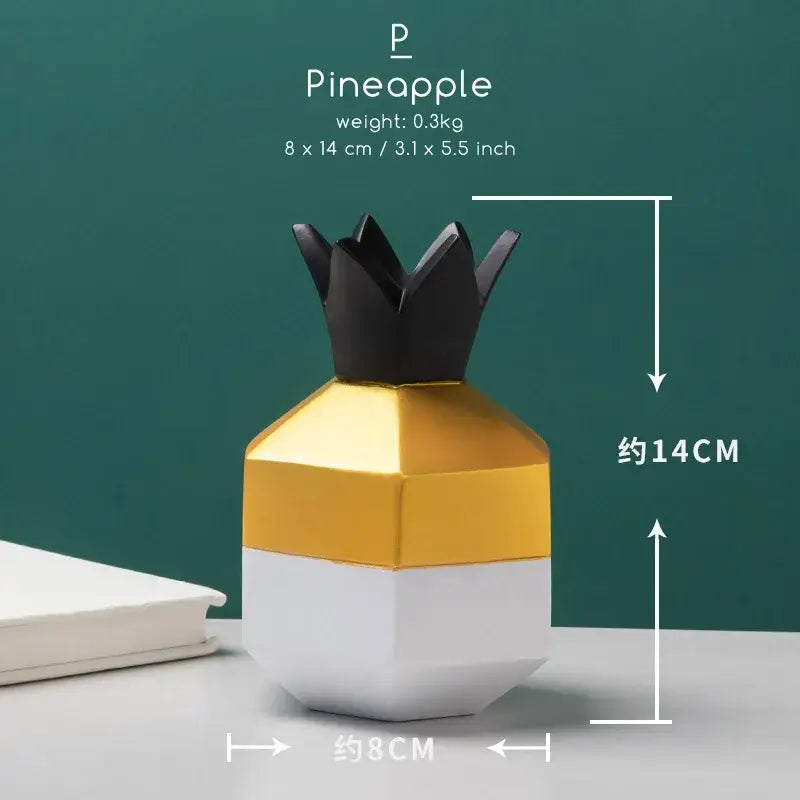 A sleek geometric pineapple-shaped decorbites bird figurine with black crown gold midsection and white base office phone holder