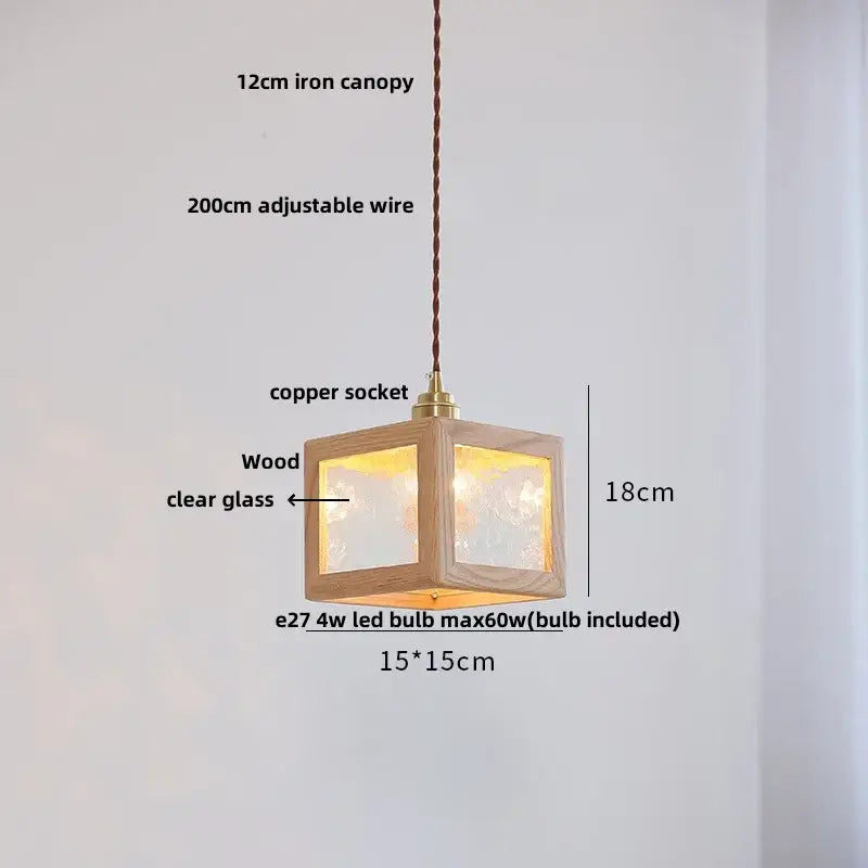 A warm-lit 18cm minimalist walnut and brass glass led pendant lamp with natural wood frame for dining room use