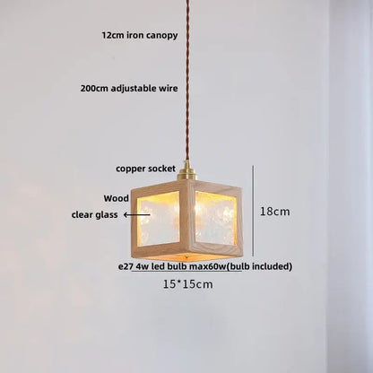 A warm-lit 18cm minimalist walnut and brass glass led pendant lamp with natural wood frame for dining room use