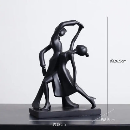 Black resin abstract figures sculpture of two stylized dancers in an elegant pose for minimalist living room decor