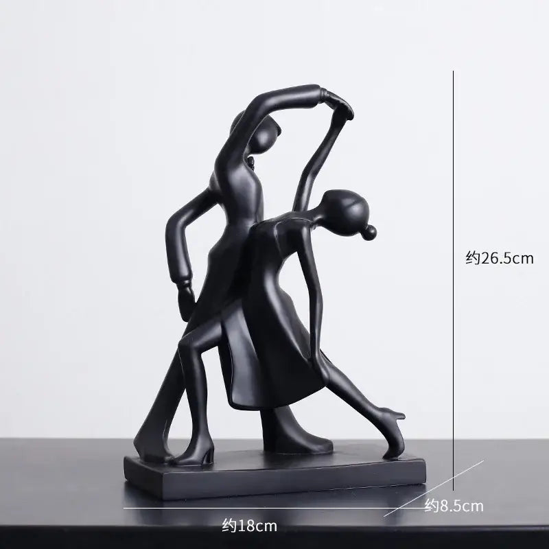 Black resin abstract figures sculpture of two stylized dancers in an elegant pose for minimalist living room decor