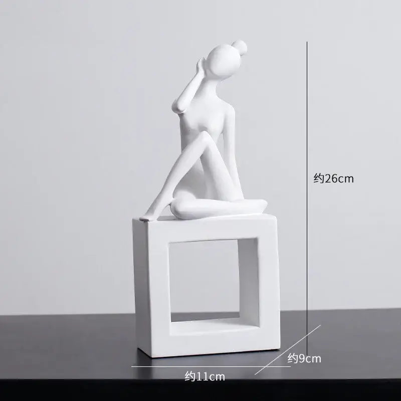 Minimalist white ceramic abstract figures sculpture of a seated woman with hand to ear on a square base for living room decor