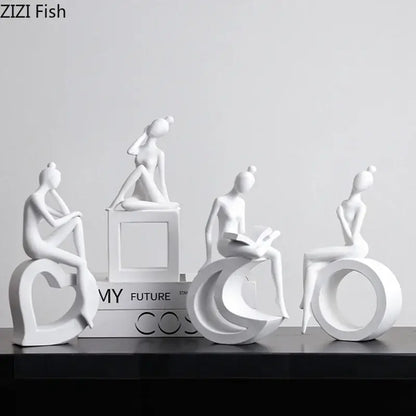 Minimalist white resin abstract figures sculpture featuring stylized women on geometric bases for living room decor