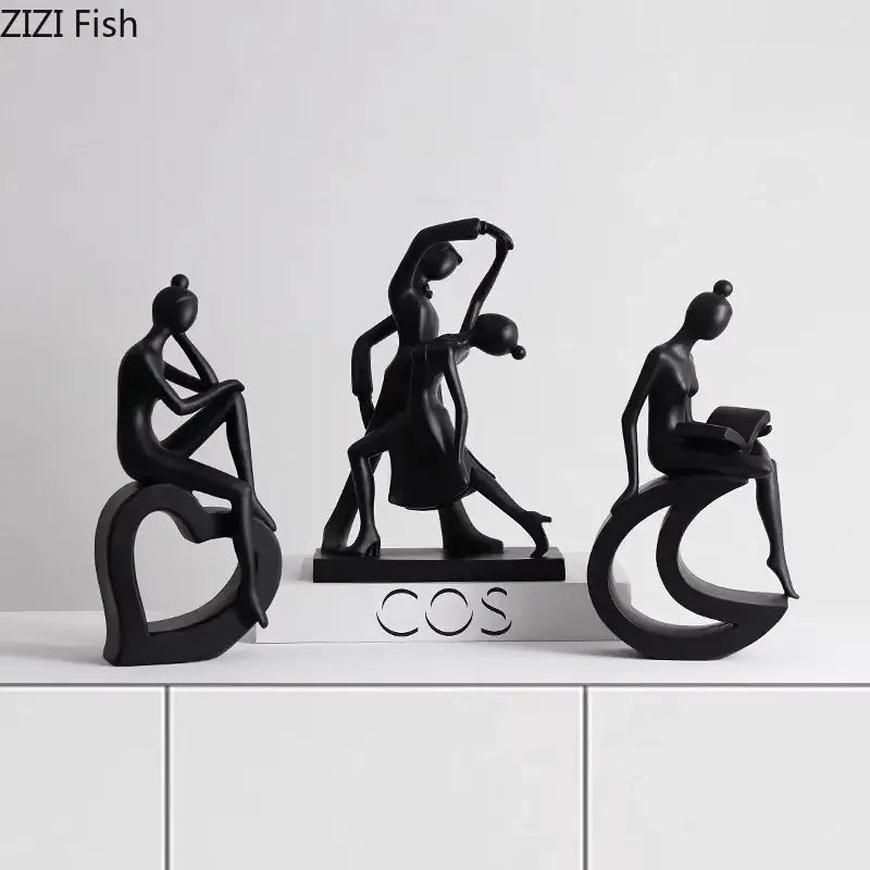 Set of three sleek black resin abstract figures sculpture in graceful poses for minimalist living room decor