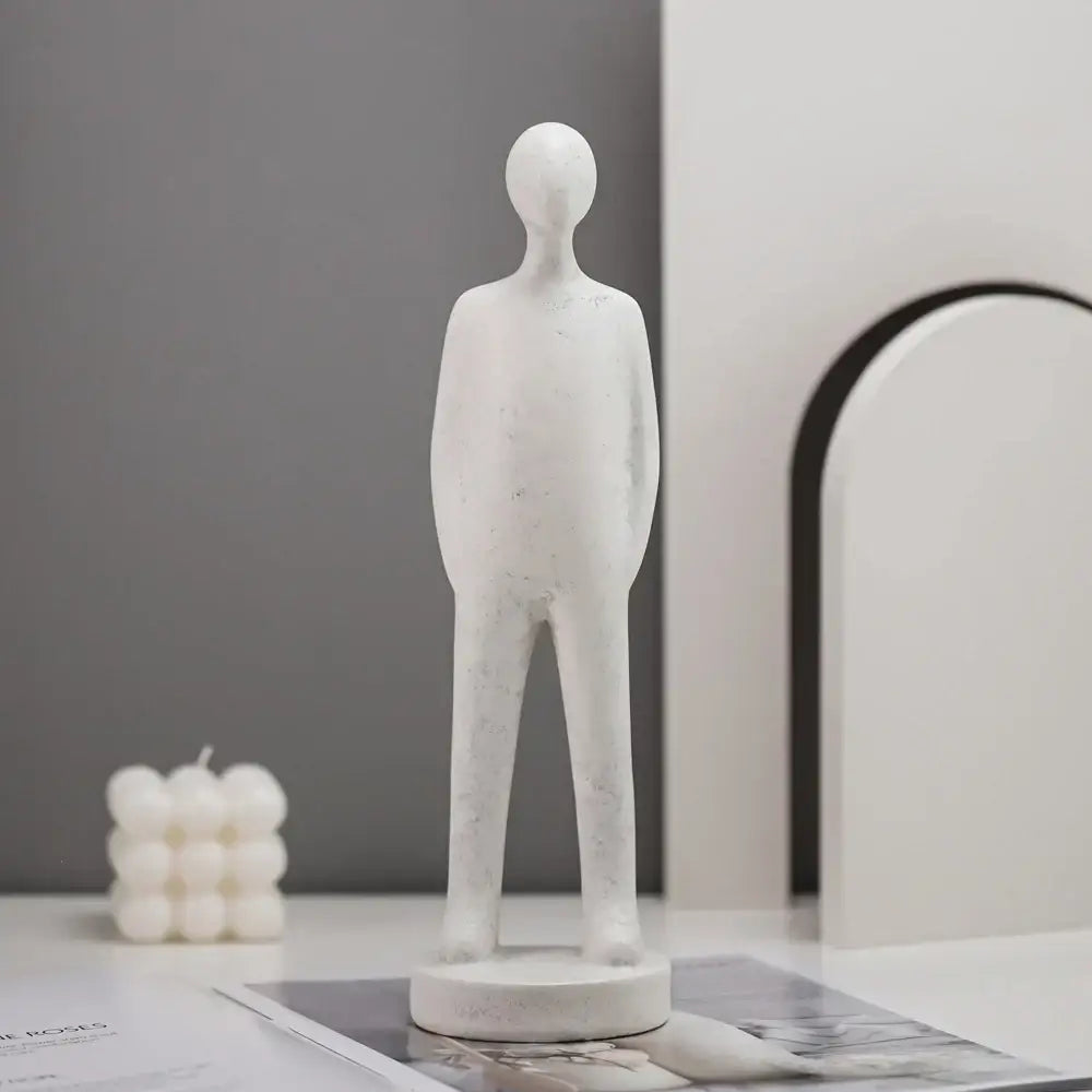 Minimalist white abstract people resin statue with smooth textured surface on circular base for living room decorbites decor