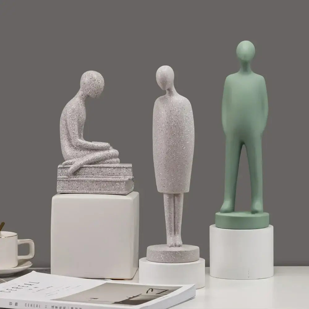 Minimalist white abstract people resin statue set featuring gray speckled, silver-gray, and sage green decorbites abstract people
