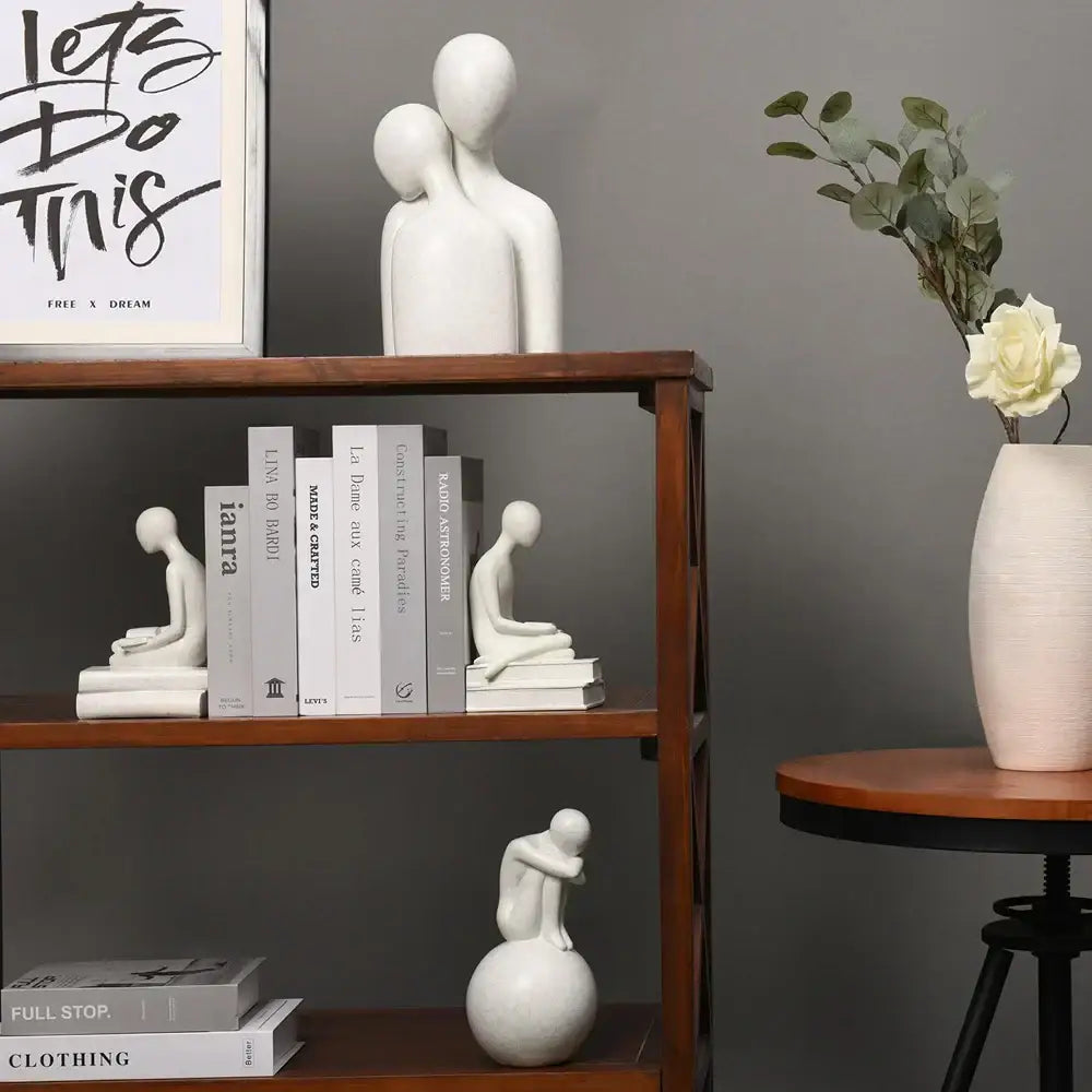 Minimalist white abstract people resin statue set featuring two smooth glossy decorbites abstract people figures embracing
