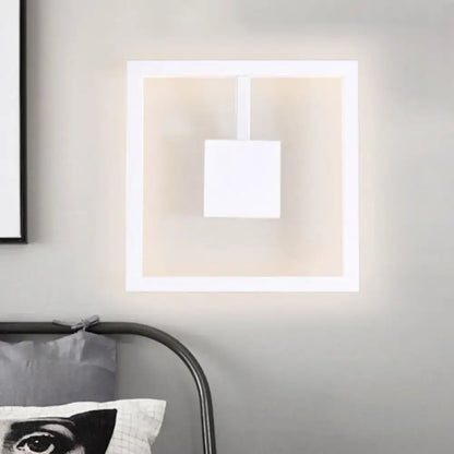 Minimalist white acrylic wall light fixture with soft ambient lighting and direct wired electric installation for bedroom use