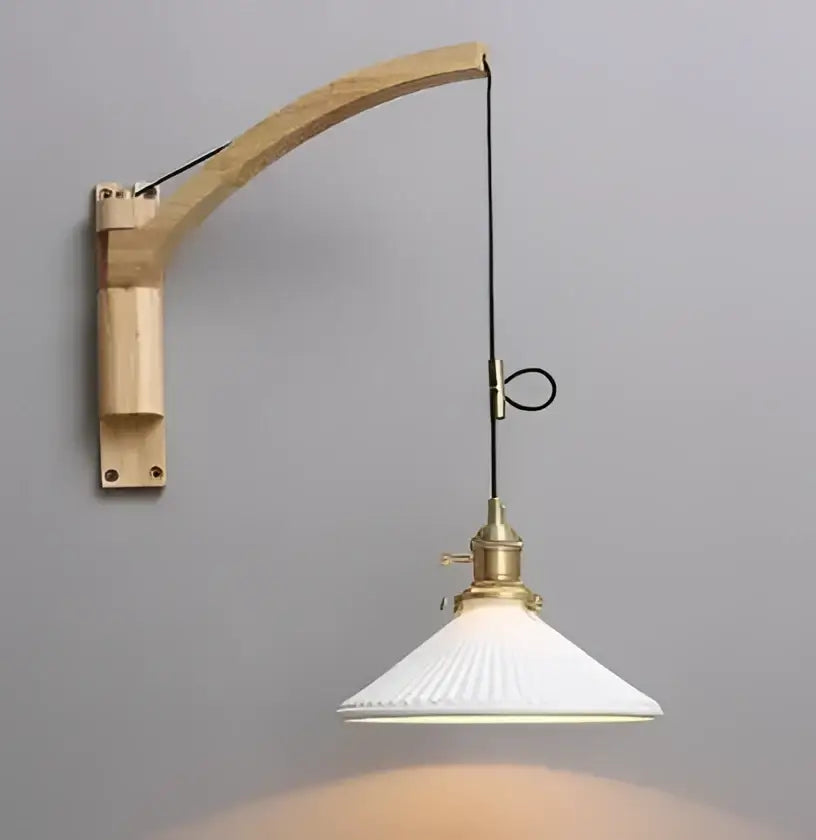 Minimalist white and black glass pendant light with vintage wooden arm and brass hardware for bedroom lighting
