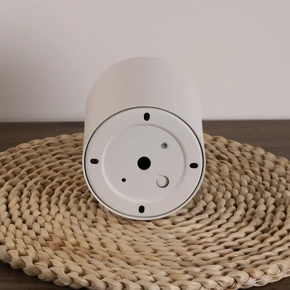 Minimalist white smart speaker with cylindrical design and mounting holes ideal for decorbites led ceiling bathroom decorbites led ceiling