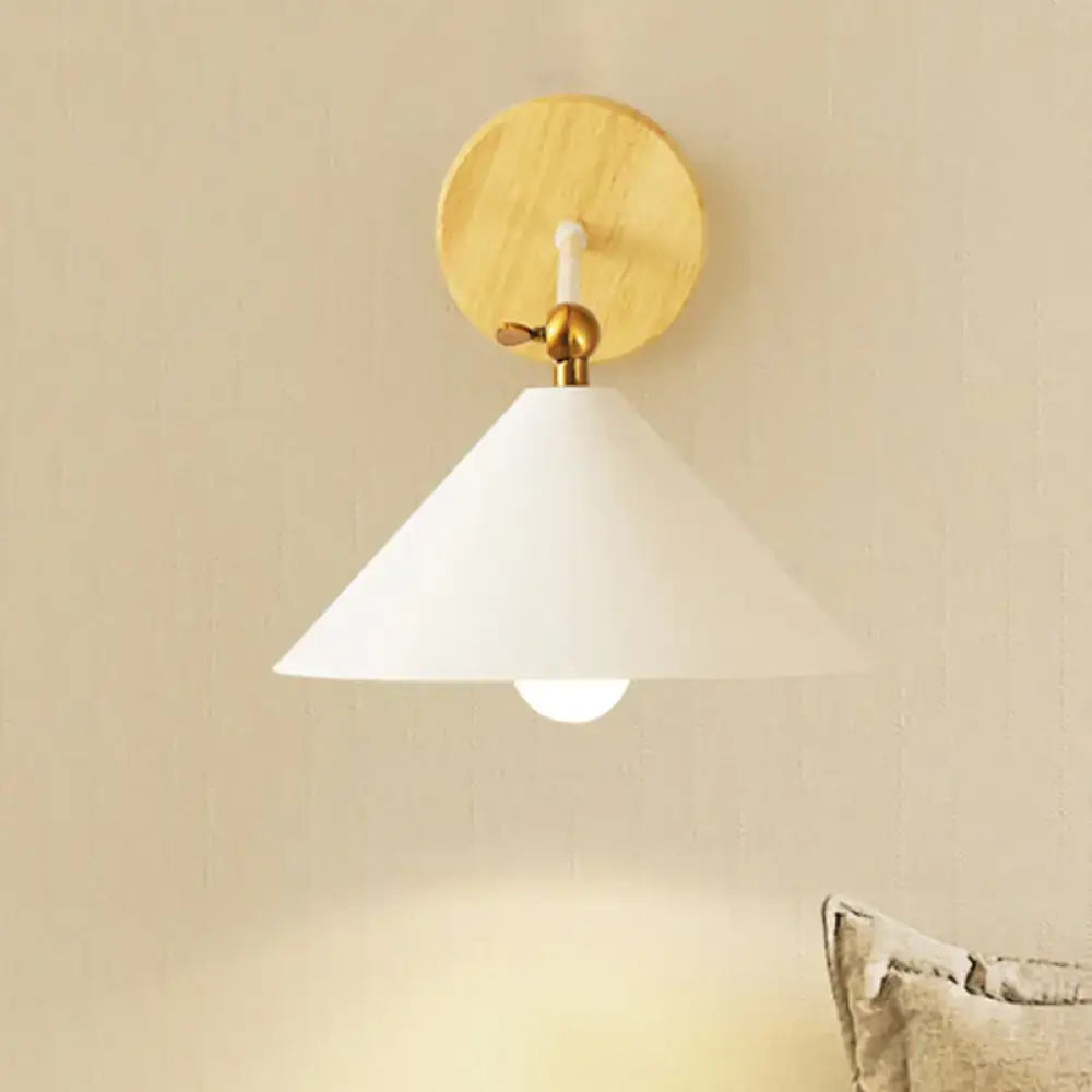 Minimalist white and brass pyramid wall lighting with conical shade and wooden backplate for bedroom wall lighting