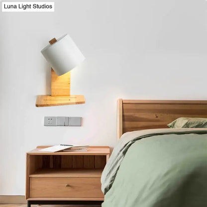 Minimalist white and green nordic wooden wall sconce with cylindrical white shade and natural wood base for bedroom light