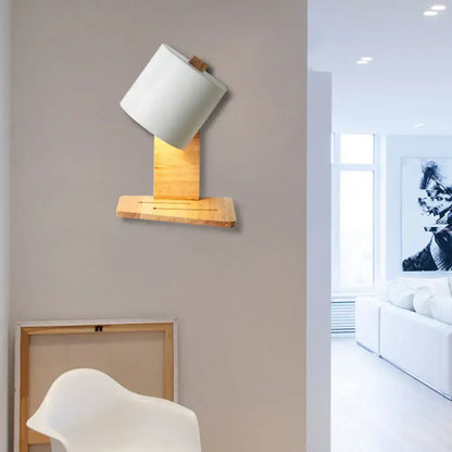 Minimalist white and green nordic wood wall sconce with white cylindrical lampshade and light wood base for bedroom lighting
