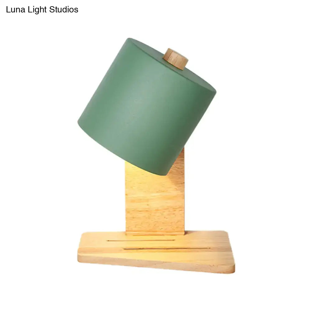 Minimalist white green nordic wood wall sconce with matte green cylindrical lampshade and light wood base for bedroom use