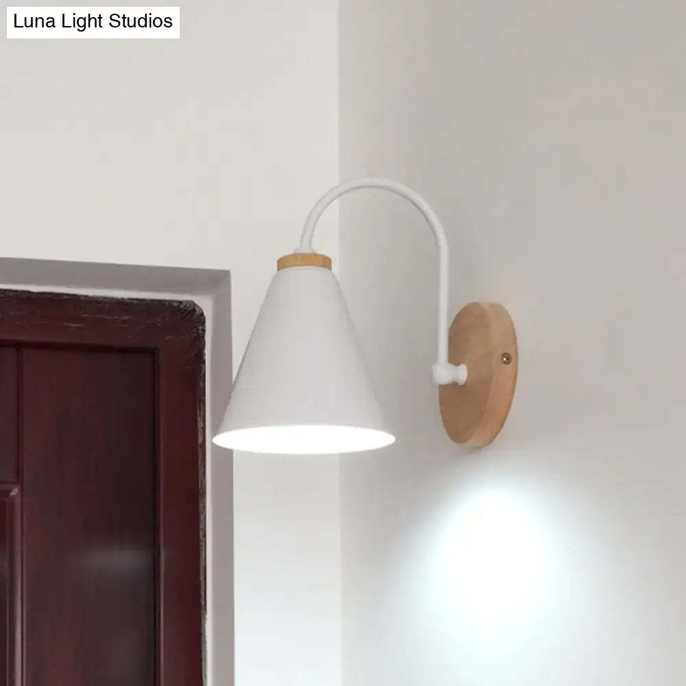 Minimalist white conical wall sconce with curved metal arm and natural wood plate for bedroom wall light use