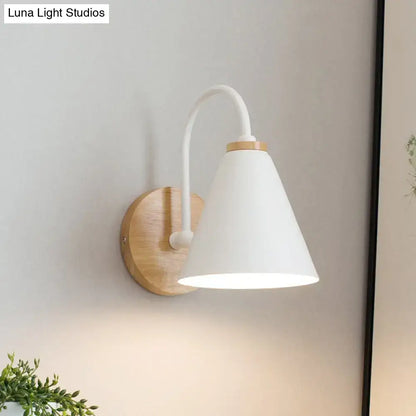 Minimalist white conical wall sconce with curved metal arm and natural wood base suitable for led incandescent fluorescent wall light