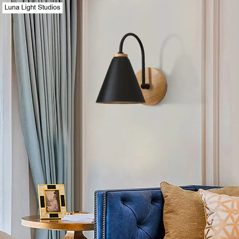 Black conical wall sconce with wooden base and curved metal arm for minimalist bedroom wall light with led options