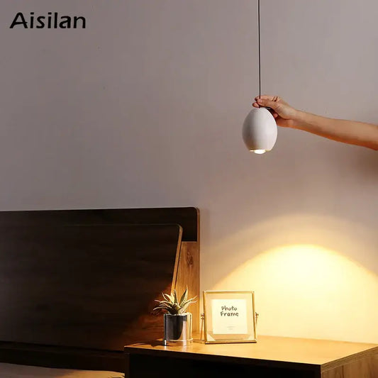 Minimalist white ceramic egg adjustable pendant light by decorbites with sleek design for kitchen spotlight and decor