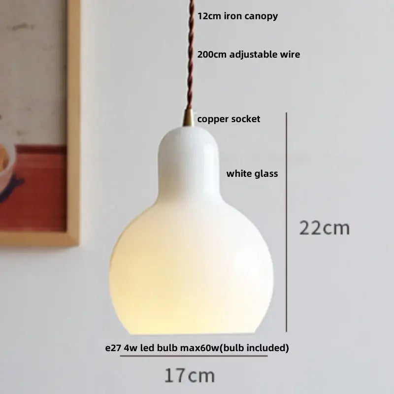 Minimalist white glass led pendant lamp with smooth rounded shape and iron canopy for warm dining room glow