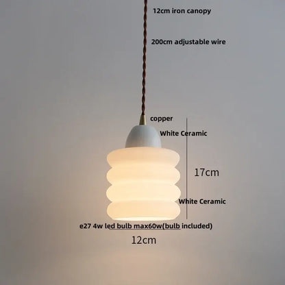 Minimalist white ceramic led pendant lamp with stacked tiers and copper canopy for warm dining room glow pendant lamp