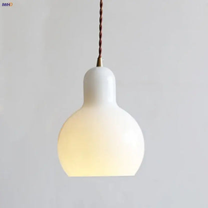 Minimalist white ceramic led pendant lamp with warm glow and twisted brown cord ideal for dining room lighting