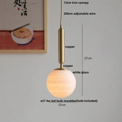 Minimalist white ceramic led pendant lamp with a warm glow featuring a glass led pendant and copper finish