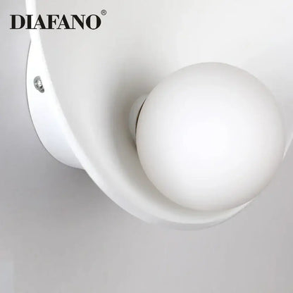Minimalist white ceramic led wall sconce with frosted glass globe and curved housing for bedroom lighting