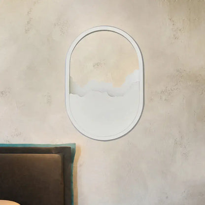 Oval-shaped white minimalist wall sconce mirror with cloud-like cutout design suitable for 220v-240v 110v-120v wall lamp use
