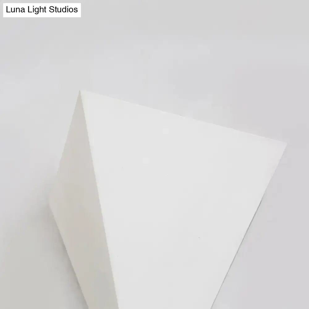 Minimalist white cone led wall lamp featuring a smooth matte triangular prism design for living room decor