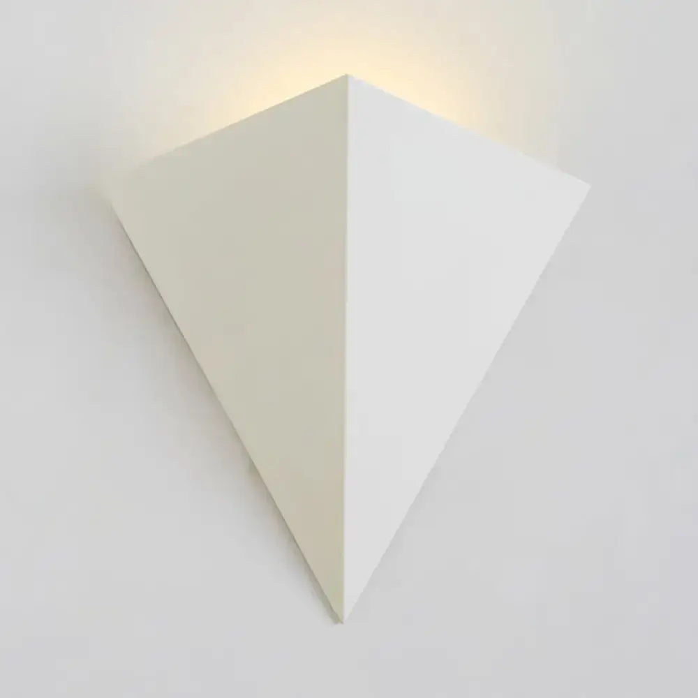 Minimalist white cone led wall lamp with triangular shape and warm light ideal for living room decor