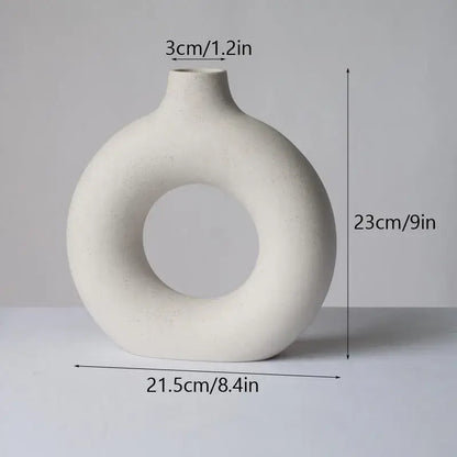 Minimalist off-white decorbites ceramic donut vase with ring-shaped body and narrow neck for living room decor