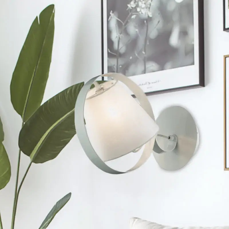 Minimalist white fabric wall light with metal ring featuring a matte white diffused lampshade and sleek frame