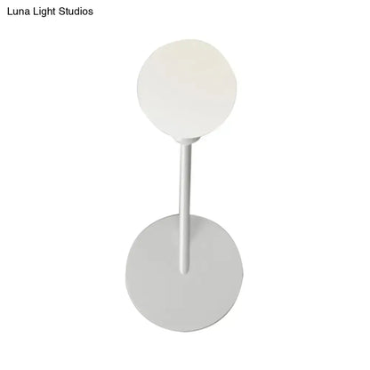 Minimalist white finish wall lamp with frosted glass spherical shade and cylindrical stem for bedroom 110v-120v use
