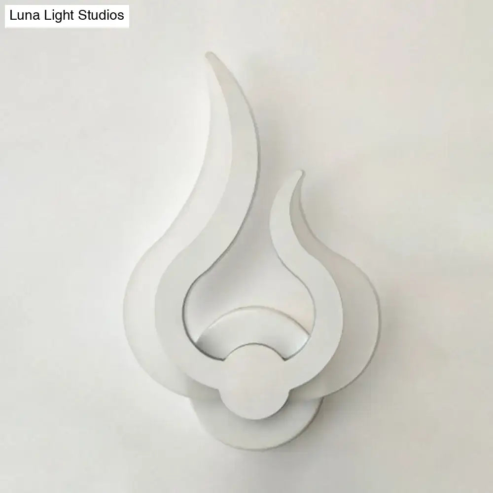 Minimalist white layered flame-shaped wall sconce with LED light designed for bedroom use in a modern style