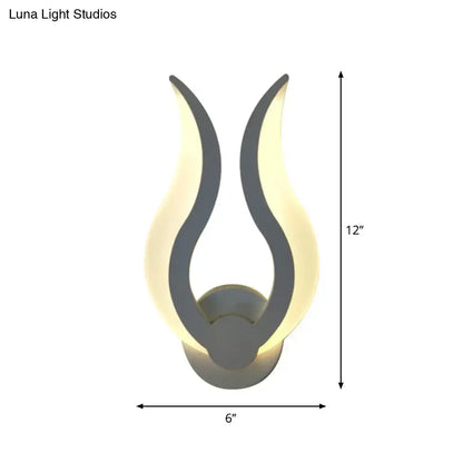 Minimalist white flame wall sconce bedroom led light with sleek gray metallic finish and warm glowing illumination