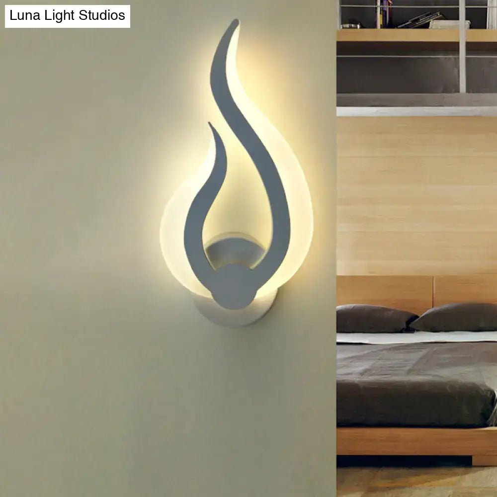 Minimalist white flame wall sconce in matte gray with warm white LED light for modern bedroom decor