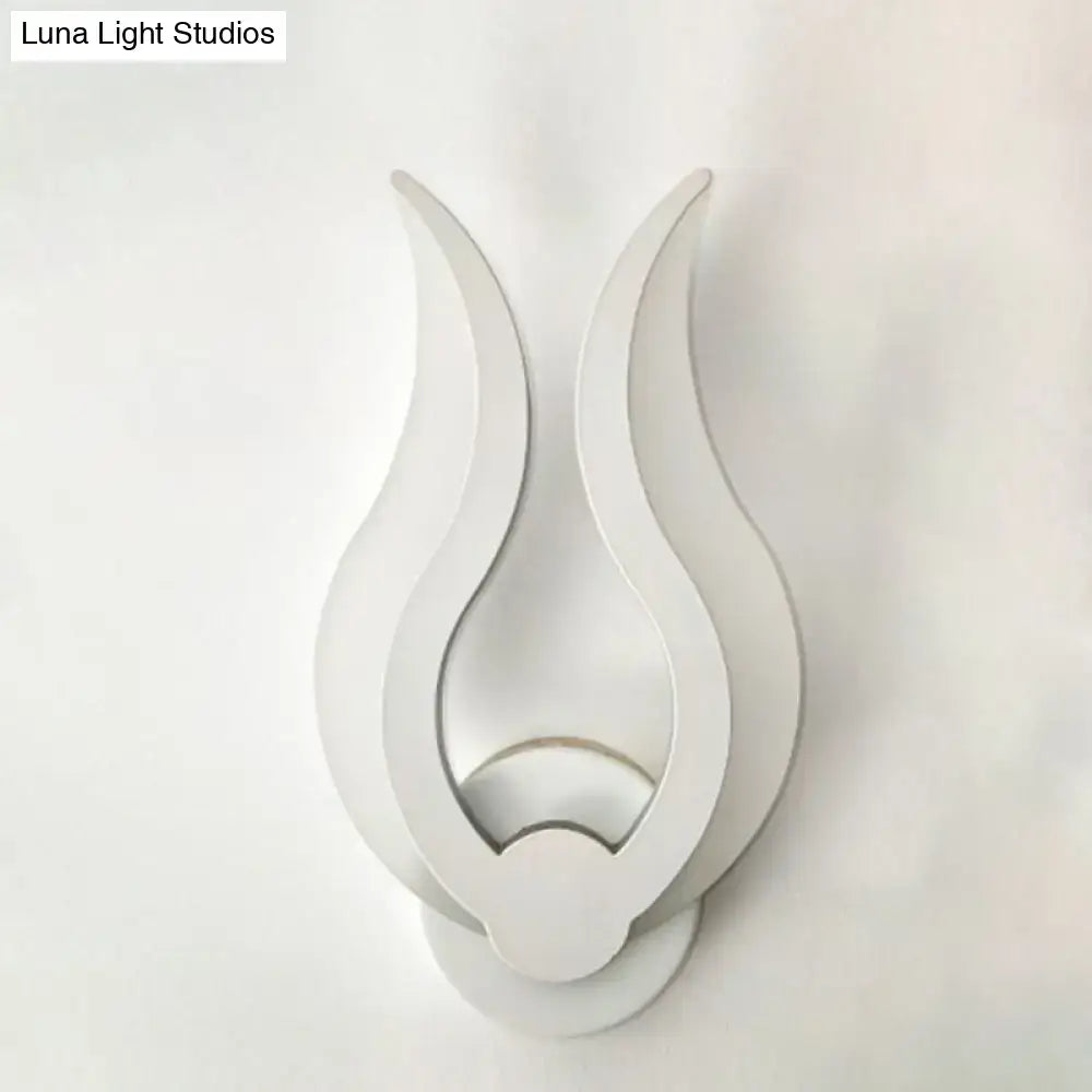 Minimalist white flame wall sconce with sleek minimalist design and LED light for bedroom use