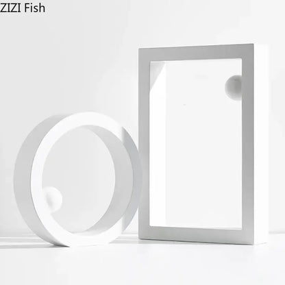 Minimalist white geometric circle desk ornament featuring a circular ring and rectangular frame with spherical elements