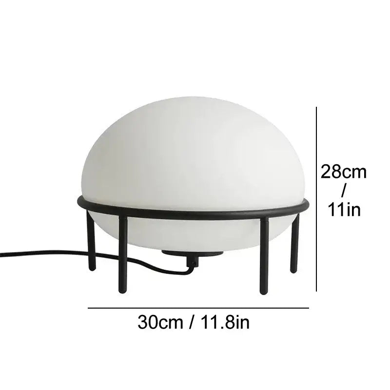 Minimalist white glass ball table lamp with frosted dome on a black metal frame ideal for modern decorbites glass ball decor