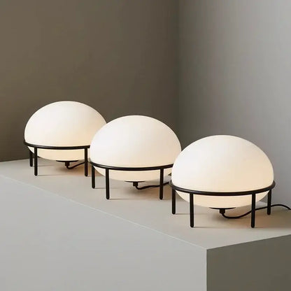 Three minimalist table lamps with frosted white glass ball globes and black metal frames for bedroom decorbites glass ball table