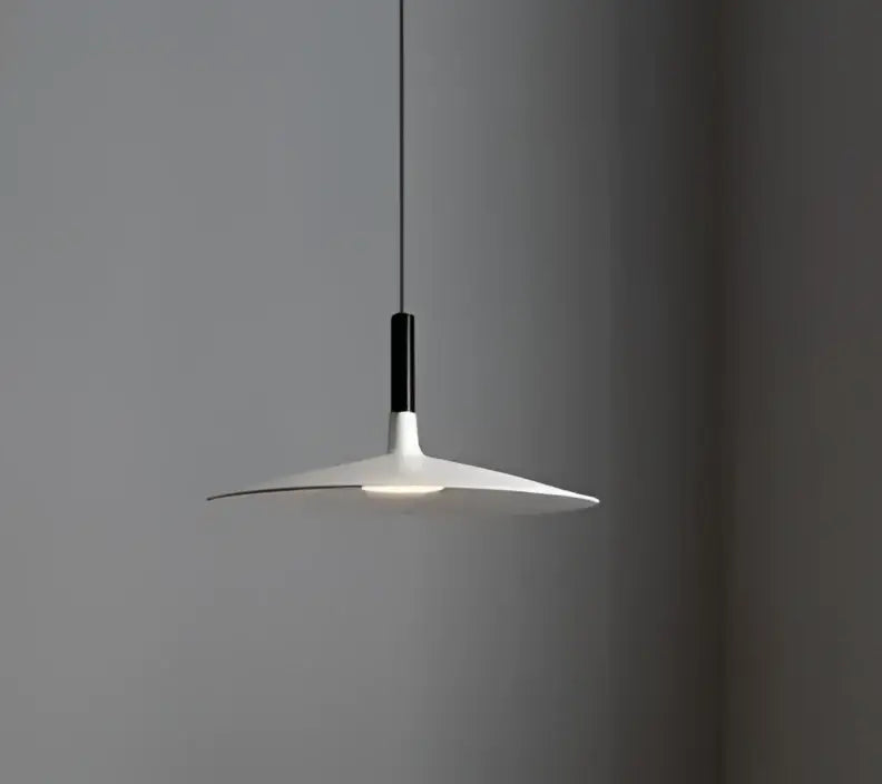Minimalist white glass pendant light with sleek disc-shaped shade and black stem ideal for dining room pendant lights