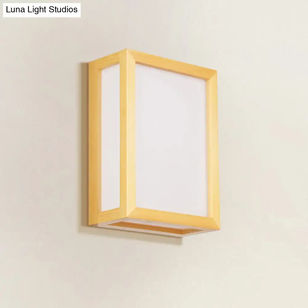 Minimalist wall sconce with white glass diffuser and wooden frame designed for corridor lighting