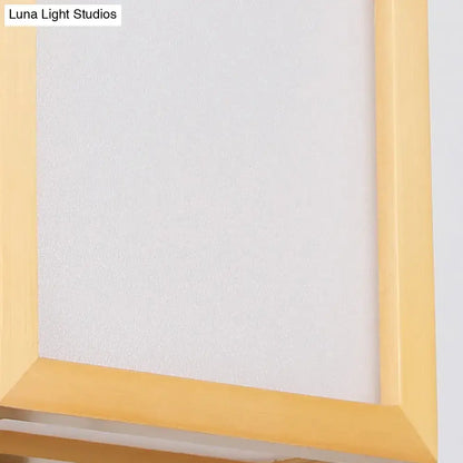 Minimalist wall sconce with white glass and a light yellow wooden frame designed for corridor lighting